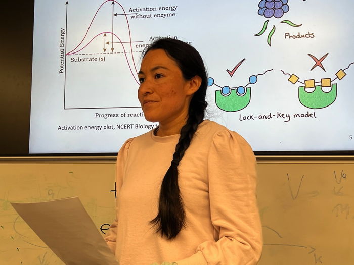 Photograph of Adriana in a lecture theatre.